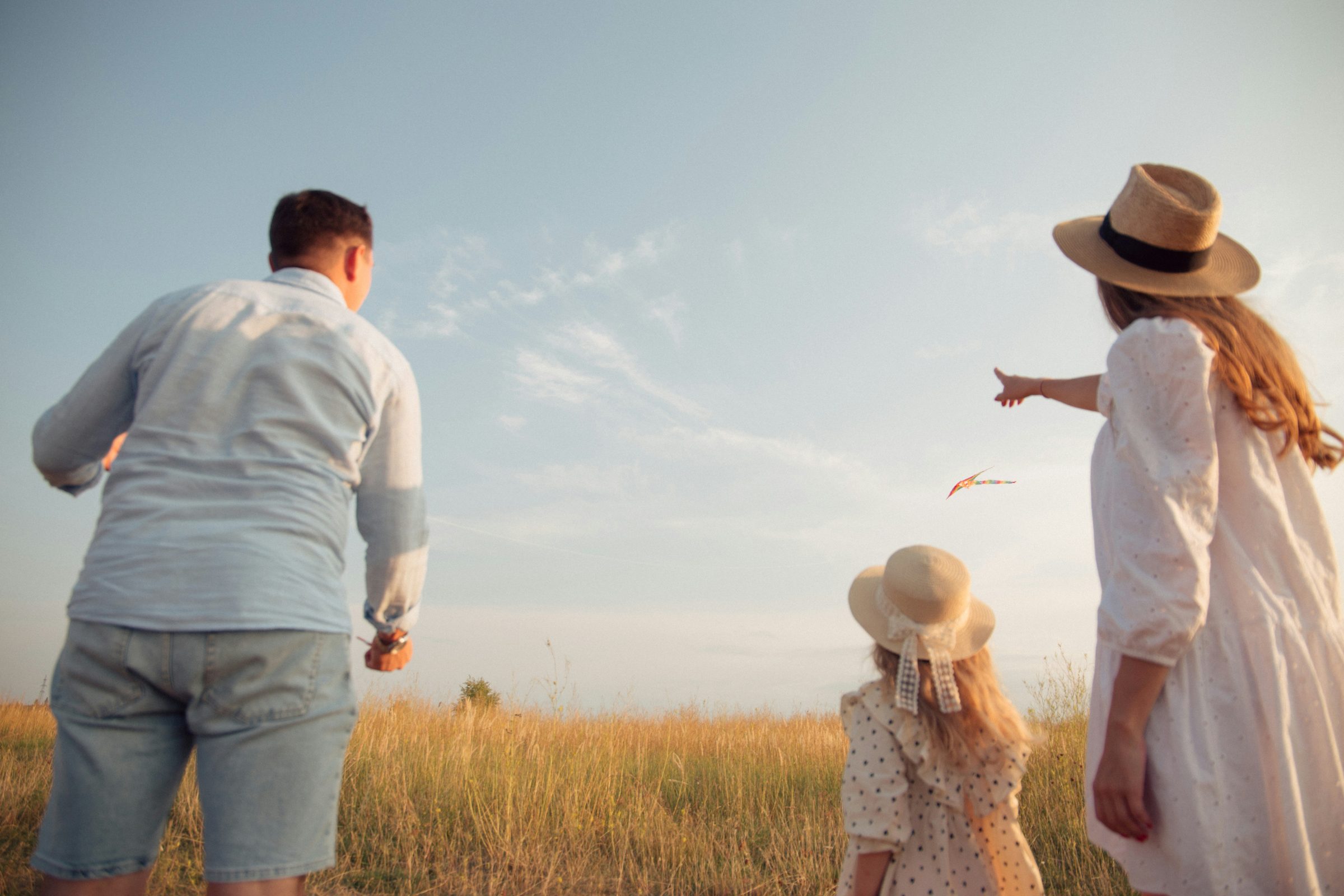 Family flying a kite together outdoors